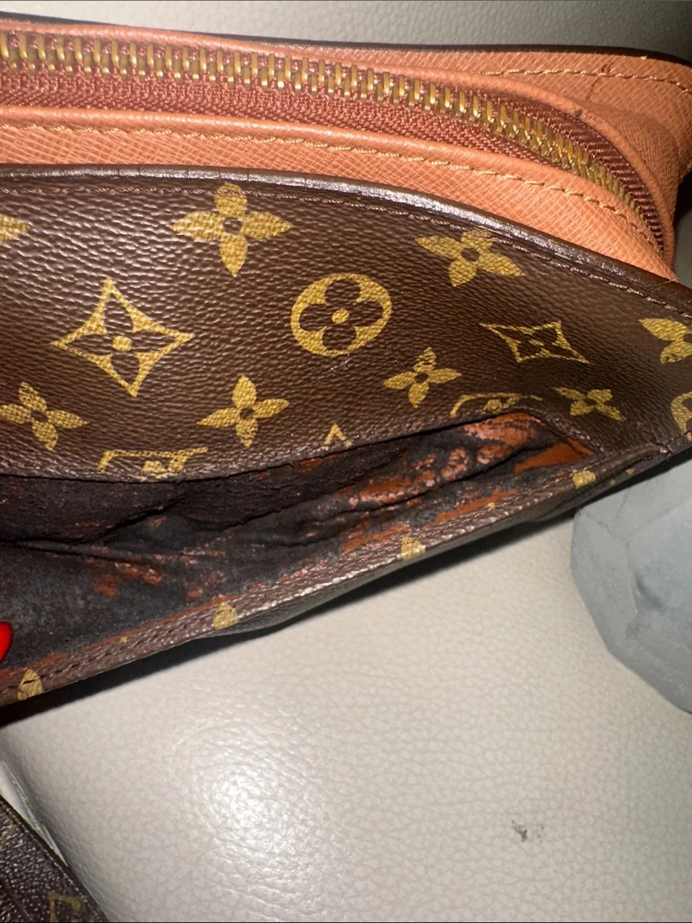 Louis Vuitton Monogram Canvas Wristlet in Brown and Gold